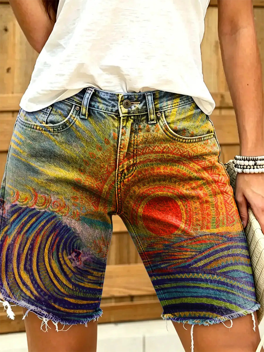 Women's art print denim shorts with a sunset beach pattern
