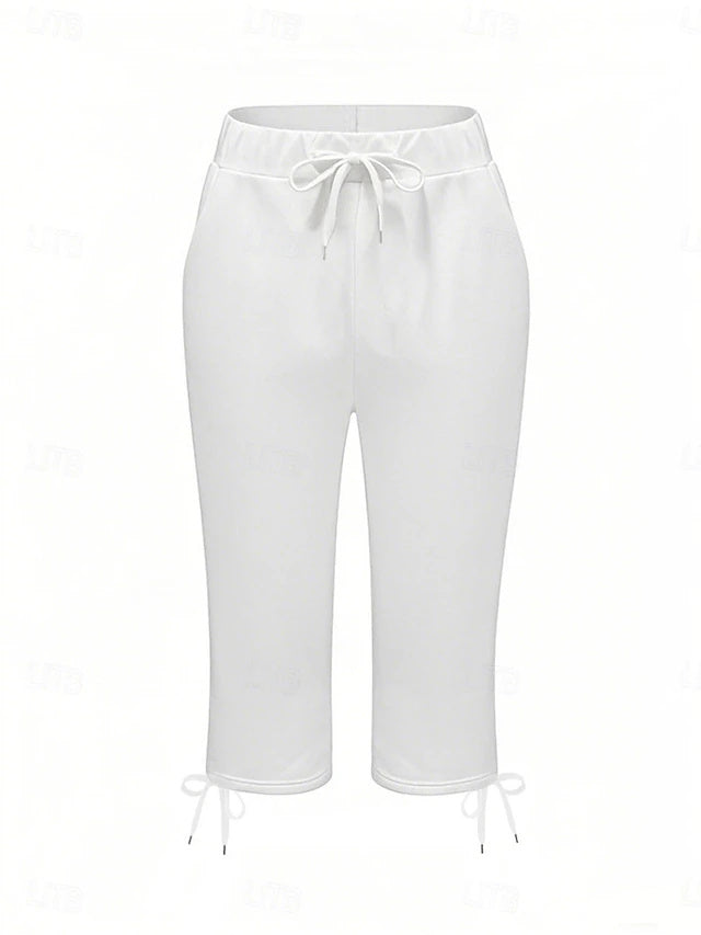 Slim silhouette with stretch fabric, practical drawstring and pockets, casual street style for spring and summer.