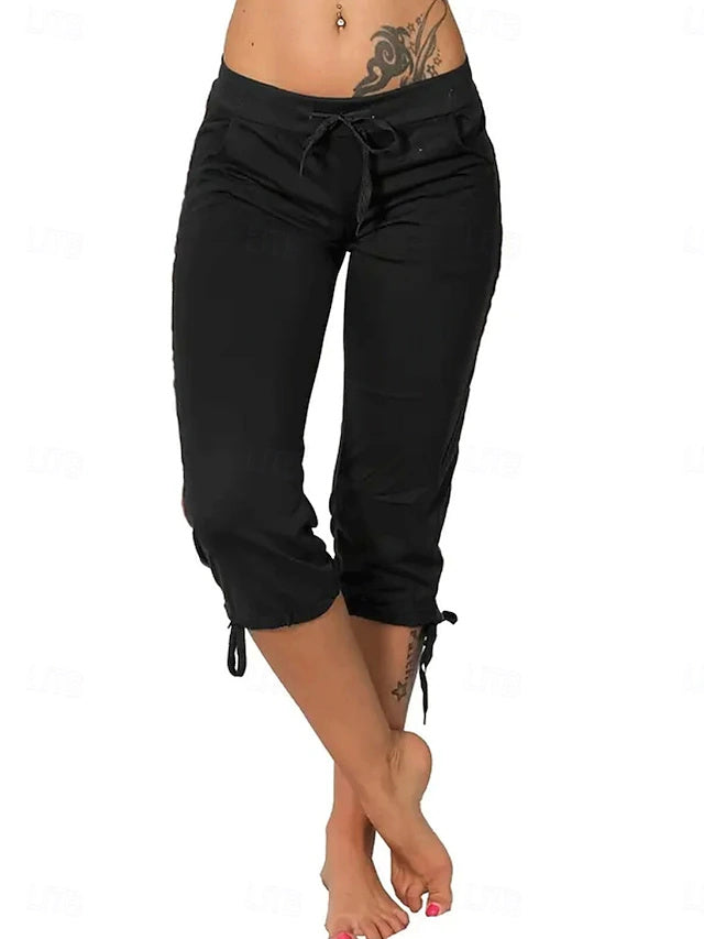Slim silhouette with stretch fabric, practical drawstring and pockets, casual street style for spring and summer.