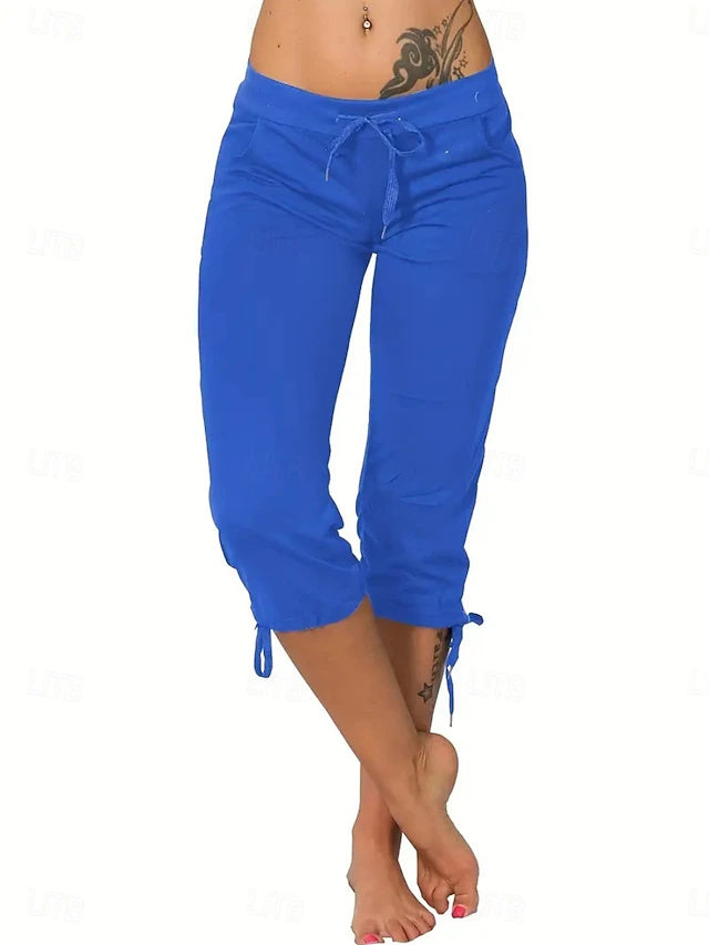 Slim silhouette with stretch fabric, practical drawstring and pockets, casual street style for spring and summer.
