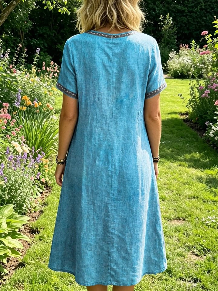 Women's Short-sleeve Round-neck Dress With Artistic Bird Print And Cutout Details